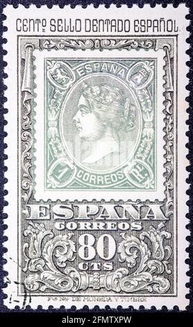 ESPAGNE - VERS 1965: Timbre imprimé par l'Espagne, montre la reine Isabel, représentant le centenaire du premier timbre denté, vers 1965 Banque D'Images