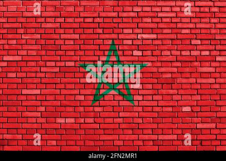 Drapeau du Maroc peint sur un mur de briques Banque D'Images