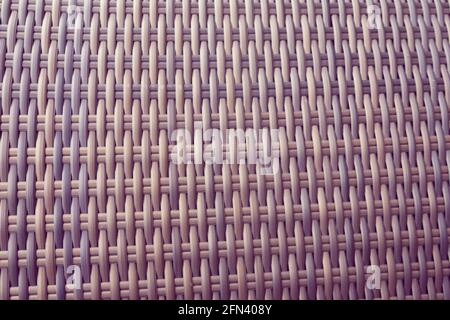 Toile de fond synthétique de tissage de texture rotin utilisé sur les meubles de jardin extérieurs. Banque D'Images