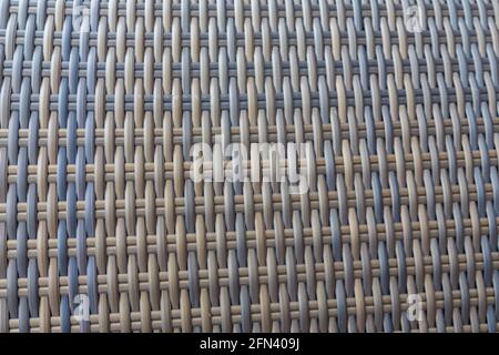 Toile de fond synthétique de tissage de texture rotin utilisé sur les meubles de jardin extérieurs. Banque D'Images