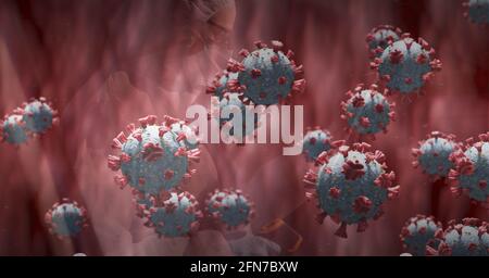 Composition de cellules 3d covid 19 flottant sur fond rouge Banque D'Images