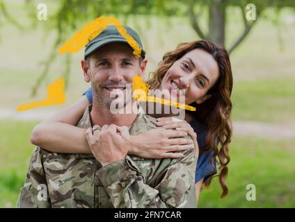 Composition de la maison dessinant sur le portrait d'un soldat masculin souriant avec sa femme Banque D'Images