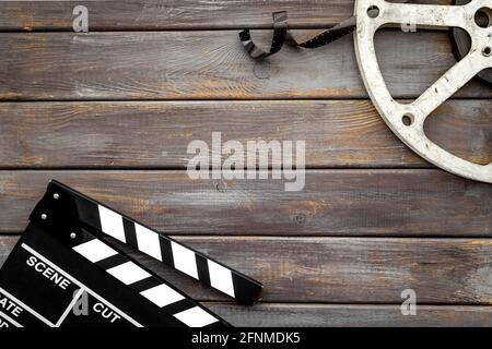 Arrière-plan cinéma avec clapperboard et bobine de film Banque D'Images
