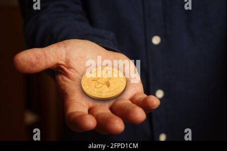 Symbole de crypto-monnaie XLM stellaire concept de pièce en main abstraite. Banque D'Images