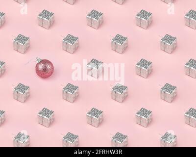Motif isométrique de Noël. Composition minimale faite de boîtes-cadeaux argentées de Noël et boule rose sur fond rose. Cadeaux de Noël, Félicitations. Banque D'Images