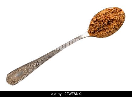 vue de dessus du sucre granulé de fleur de noix de coco dans une cuillère à café d'argent découpe sur fond blanc Banque D'Images