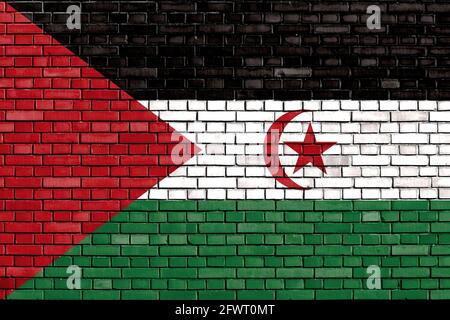 Drapeau du Sahara occidental peint sur un mur de briques Banque D'Images