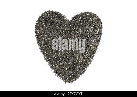 Coeur fait de graines de chia sur fond blanc. Graines de Chia sur fond blanc Banque D'Images