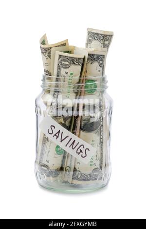 pot en verre pour des économies surchargées de billets de banque en dollars isolés dessus arrière-plan blanc Banque D'Images
