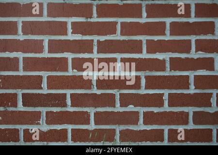 Photographie d'un vrai mur fait de briques rouges naturelles Banque D'Images