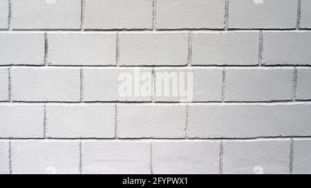 Texture des murs à partir de blocs gris carrés. Paroi de lissage. Mur décoratif en béton. Copier l'espace. Banque D'Images