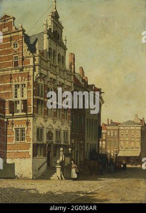 L'Hôtel de ville, la Haye. L'hôtel de ville de la Haye. À l'escalier une femme marche avec un panier, juste à l'ombre est une calèche. Banque D'Images