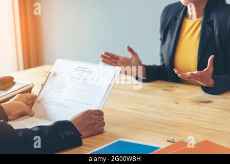 Job applicants having an interview with Human resource manager jobs interview with confident candidate in an office. Stock Photo