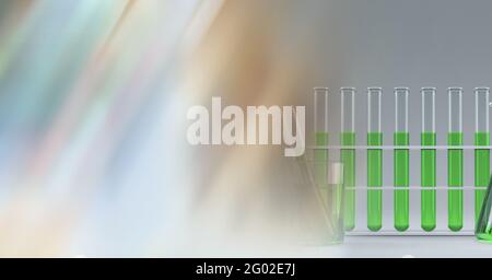 Composition de tubes à essai de liquide vert dans un rack, avec un espace de copie flou Banque D'Images