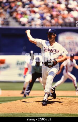 Former San Diego Padres pitcher Trevor Hoffman kisses his wife Tracy Hoffman  during a ceremony inductiing him into the Padres Hall of Fame before a.…