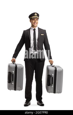 Portrait complet d'un portier dans une valise de transport uniforme et souriant isolé sur fond blanc Banque D'Images