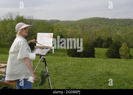 AUGUSTA, ÉTATS-UNIS - 30 avril 2009 : un artiste d'air plein peint dans le paysage du Missouri. Banque D'Images