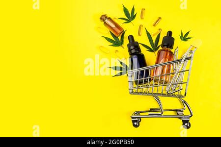 CBD Oils Capsules feuilles dans le panier, Shopping Cannabis concept produits Banque D'Images