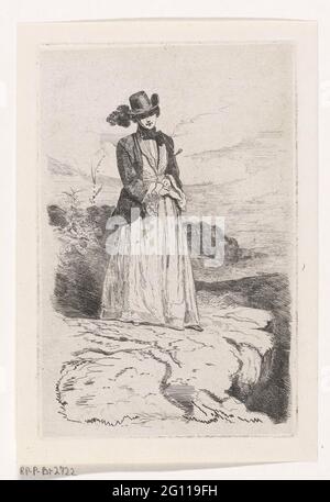 Femme debout avec balayage d'équitation. Une femme adulte vêtue du XIXe siècle. Elle se tient sur un bord de falaise et regarde droit devant. Elle a un balayage de conduite dans la main droite. Banque D'Images
