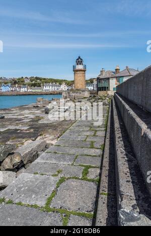 C'est un phare de la ville côtière et après le port de ferry de Portpatrick sur la péninsule de Dumfries et Galloway sur la côte ouest de l'Écosse Banque D'Images