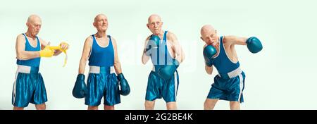 Homme senior portant des vêtements de sport de boxe isolés sur fond de studio. Concept de sport, d'activité, de mouvement, de bien-être. CopySpace, publicité. Banque D'Images