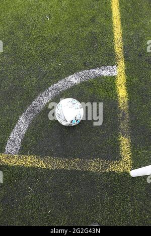 Painted markings line on all weather surface. Corner post and corner marking with football Banque D'Images