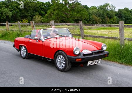 1976 Red 70s MG Midget 1500 à la 58e course annuelle de Manchester à Blackpool Vintage & Classic car Run l'événement est un « Touring Assembly » Banque D'Images