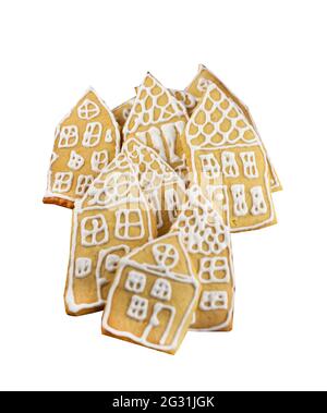Biscuits de pain d'épice isolés sur fond blanc.Gâteaux faits maison sous forme de petites maisons décorées de vernis blanc.Groupe de pain d'épice de Noël.La nourriture de Noël est un régal sucré, dessert. Banque D'Images