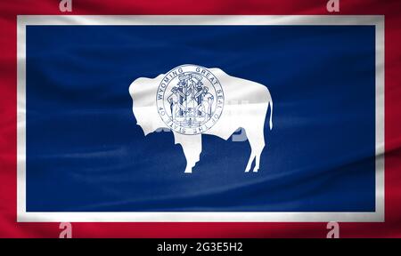 Drapeau réaliste de l'État du Wyoming sur la surface ondulée du tissu Banque D'Images