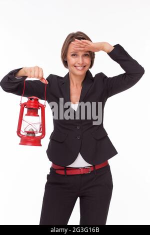 Businesswoman avec lampe rouge Banque D'Images