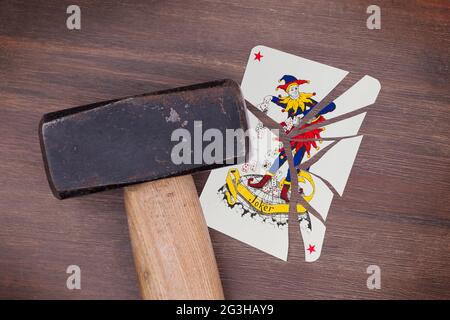 Marteler avec une carte cassée, joker Banque D'Images