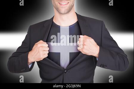 Costume d'ouverture pour homme d'affaires pour révéler une chemise avec drapeau Banque D'Images