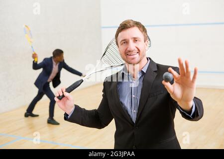 Les joueurs d'affaires Squash Banque D'Images