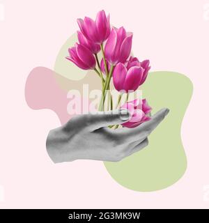 Main mâle tenant des fleurs violettes, concept de carte de vœux. Banque D'Images