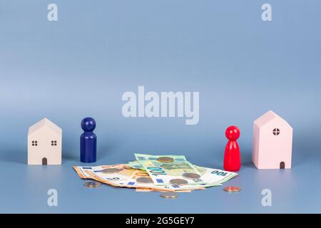 Divorce, conflit, amour brisant, couple de séparation, partenariat, concept de division de propriété avec des figures miniatures Banque D'Images