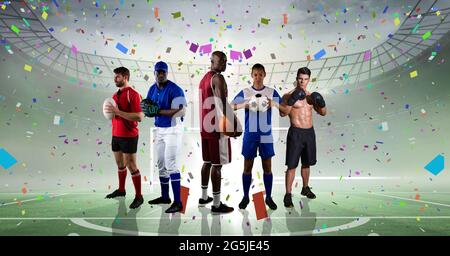 Composition des sportifs célébrant la victoire au stade avec confetti Banque D'Images