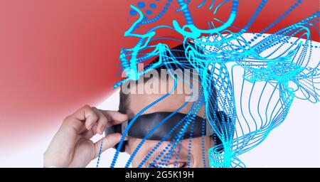 Composition de pistes lumineuses numériques avec un garçon portant un casque vr Banque D'Images