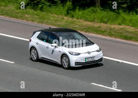 New 2021 VW iD3 white Volkswagen LIFE electric 1 speed automatic electricity SUV driving on the M6 motorway near Preston in Lancashire, UK. Banque D'Images