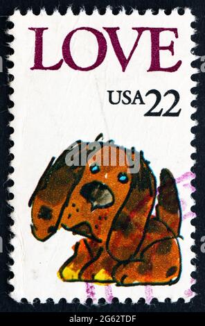 ÉTATS-UNIS D'AMÉRIQUE - VERS 1986 : un timbre imprimé aux États-Unis montre Puppy, Love, vers 1986 Banque D'Images