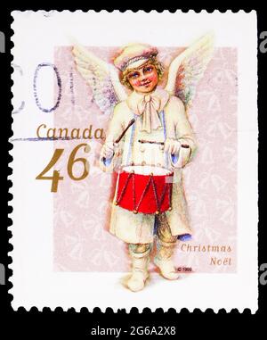 MOSCOU, RUSSIE - 18 AVRIL 2020 : le timbre-poste imprimé au Canada montre Angel avec tambour, série de Noël, vers 1999 Banque D'Images