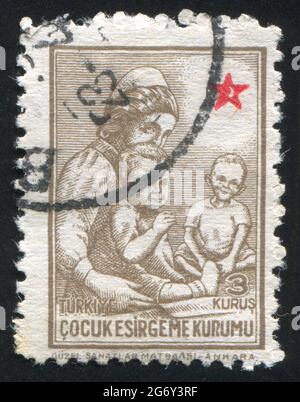 TURQUIE - VERS 1943: Timbre imprimé par la Turquie, montre soeur avec des enfants, vers 1943 Banque D'Images