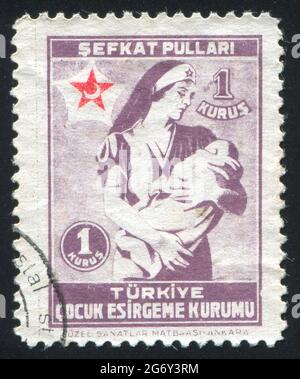 TURQUIE - VERS 1943: Timbre imprimé par la Turquie, montre l'enfant et la sœur, vers 1943 Banque D'Images