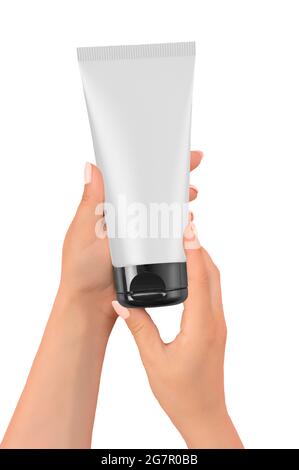 Mains de femme tenant un tube blanc mockup, isolé sur fond blanc. Mains de femme tenant un tube de crème isolé sur fond rose pastel avec cobysp Banque D'Images