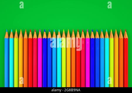 Image de crayons de couleur. Jeu de crayons de couleur sur fond vert. Gros plan Banque D'Images