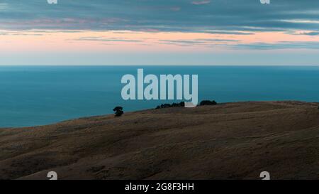 Port Hills au coucher du soleil, Canterbury, Île du Sud de la Nouvelle-Zélande. Banque D'Images