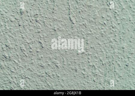 Mur en plâtre rugueux, couleur vert menthe clair, surface rayée, arrière-plan, espace de copie Banque D'Images