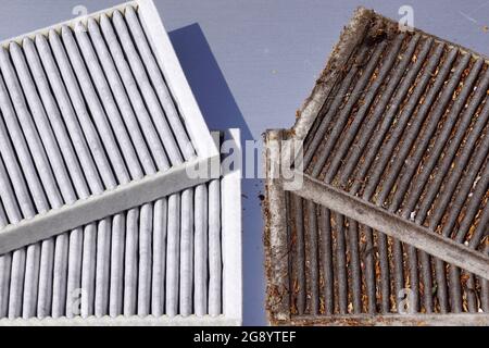 Nettoyer le filtre et le filtre usagé à remplacer. Comparaison de deux filtres de cabine de voiture. Banque D'Images