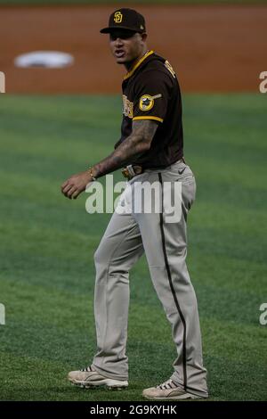 San Diego Padres troisième bassien Manny Machado (13) réagit lors d'un match de la MLB de saison régulière contre les Miami Marlins, dimanche 25 juillet 2021, à Miami. Banque D'Images