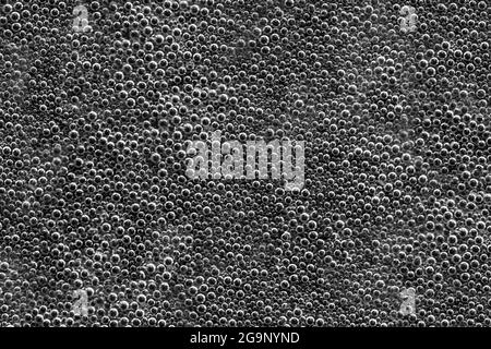 Texture des bulles d'eau sur fond noir. Mise au point douce Banque D'Images