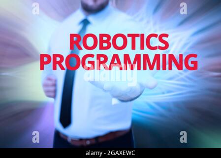 Affichage de signes Robotics programmation, logiciel de photo conceptuel qui a utilisé pour effectuer des tâches autonomes Gentelman tenue debout uniforme New Futuristi Banque D'Images